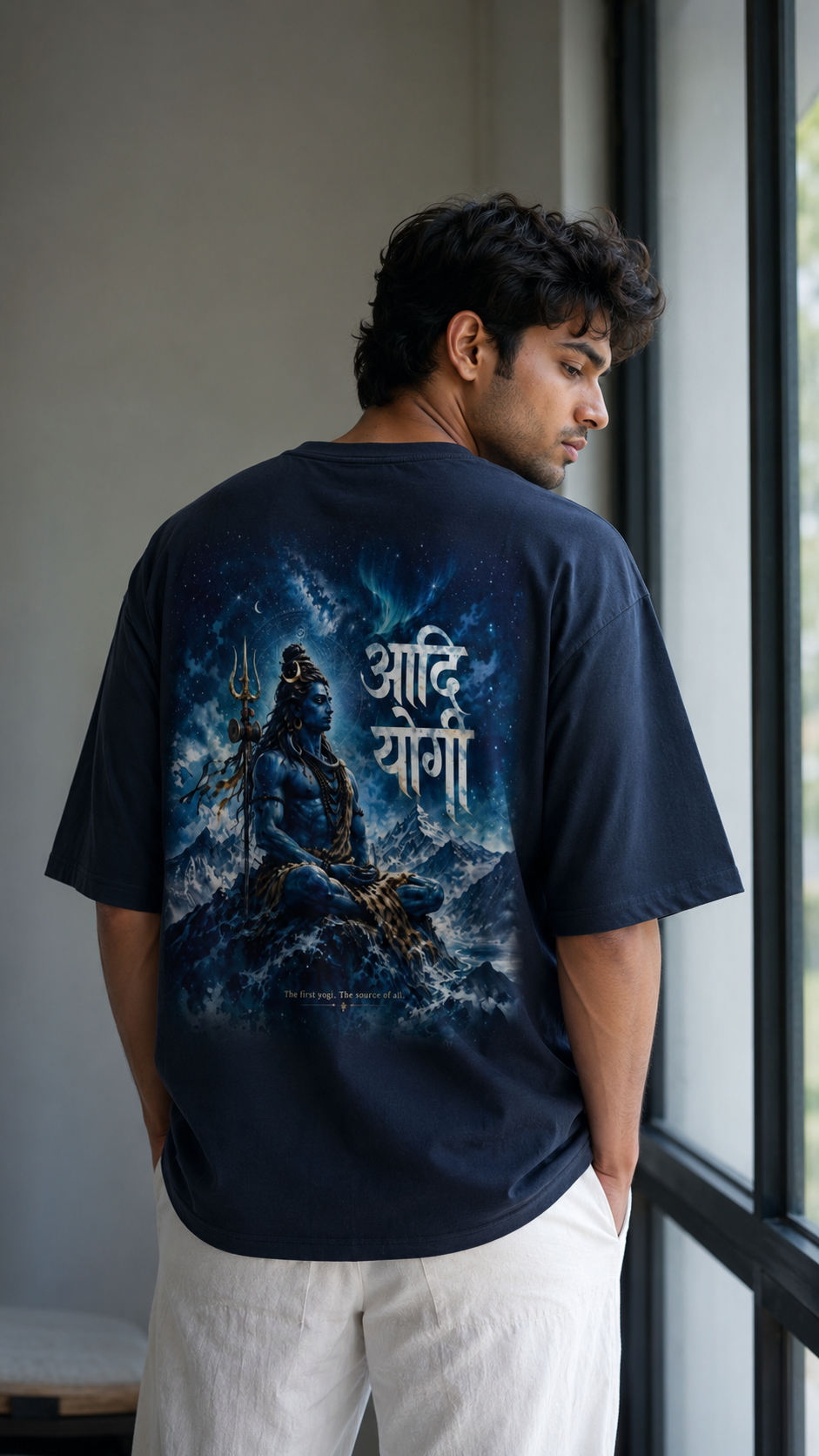 The Adiyogi Oversized T-Shirt - Male Model Wearing Navy Tee - Adiyogi Back Print - DesiThreads